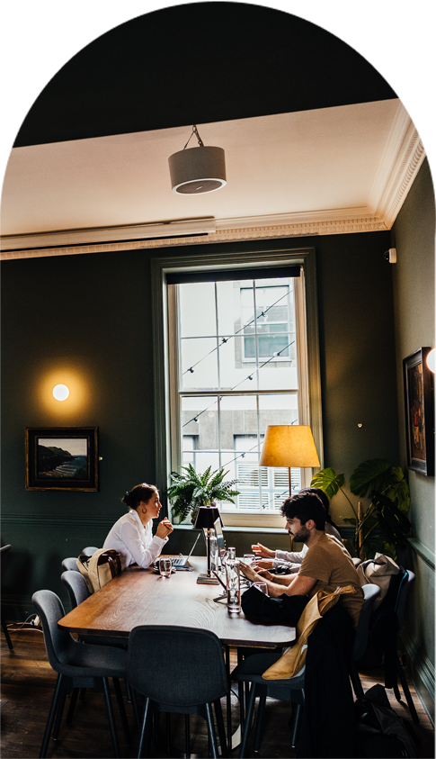Coworkers upstairs in The Library at Kindred, Bradmore house